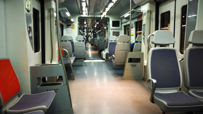 Empty train seats in a well-lit carriage, highlighting a scene related to prepaid seat discussions. Empty train seats in a well-lit carriage, highlighting a scene related to prepaid seat discussions.