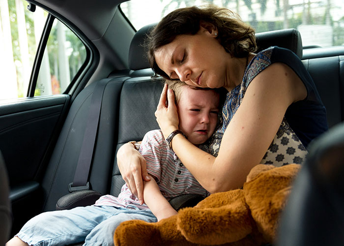Mom comforting upset son in car, dealing with stepsiblings and family dynamics, highlighting themes of being unfair and strict. Mom comforting upset son in car, dealing with stepsiblings and family dynamics, highlighting themes of being unfair and strict.