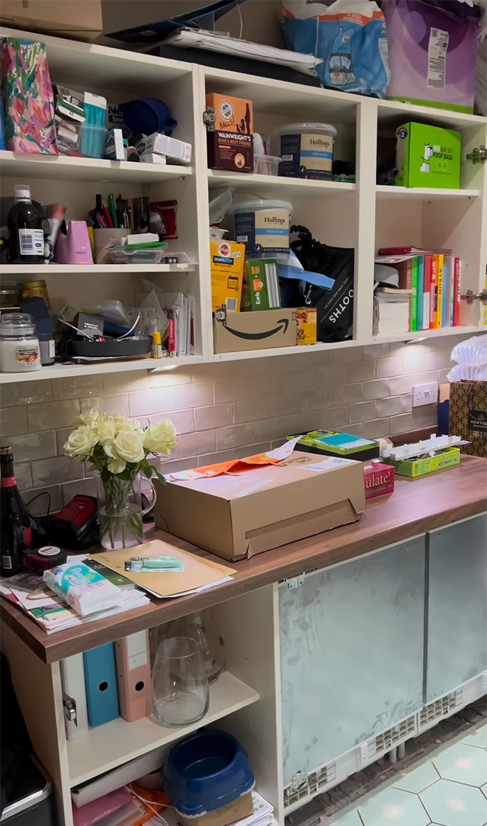 Kitchen transformation sparks fury; cluttered shelves and countertop with various items. Kitchen transformation sparks fury; cluttered shelves and countertop with various items.
