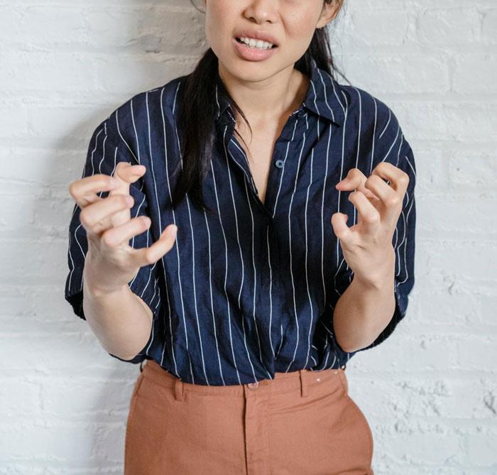 Woman in a striped shirt looking frustrated, referencing skincare misuse consequences. Woman in a striped shirt looking frustrated, referencing skincare misuse consequences.