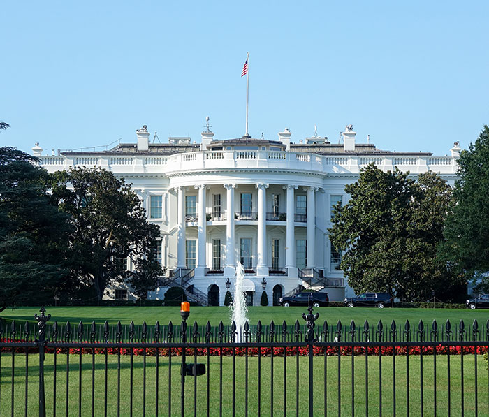 White House front view with a fountain, related to Epstein's secret documents. White House front view with a fountain, related to Epstein's secret documents.