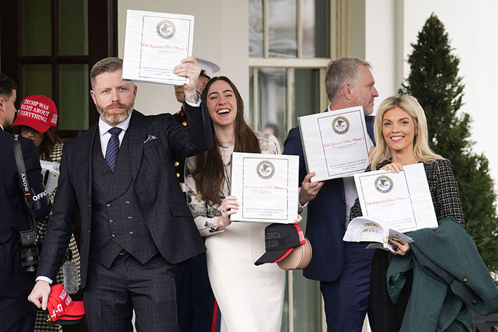 Group holding documents outside the White House related to secret Epstein files with celebrity names. Group holding documents outside the White House related to secret Epstein files with celebrity names.