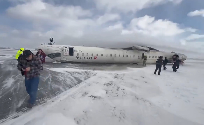 Overturned Delta plane on snow-covered ground. Overturned Delta plane on snow-covered ground.
