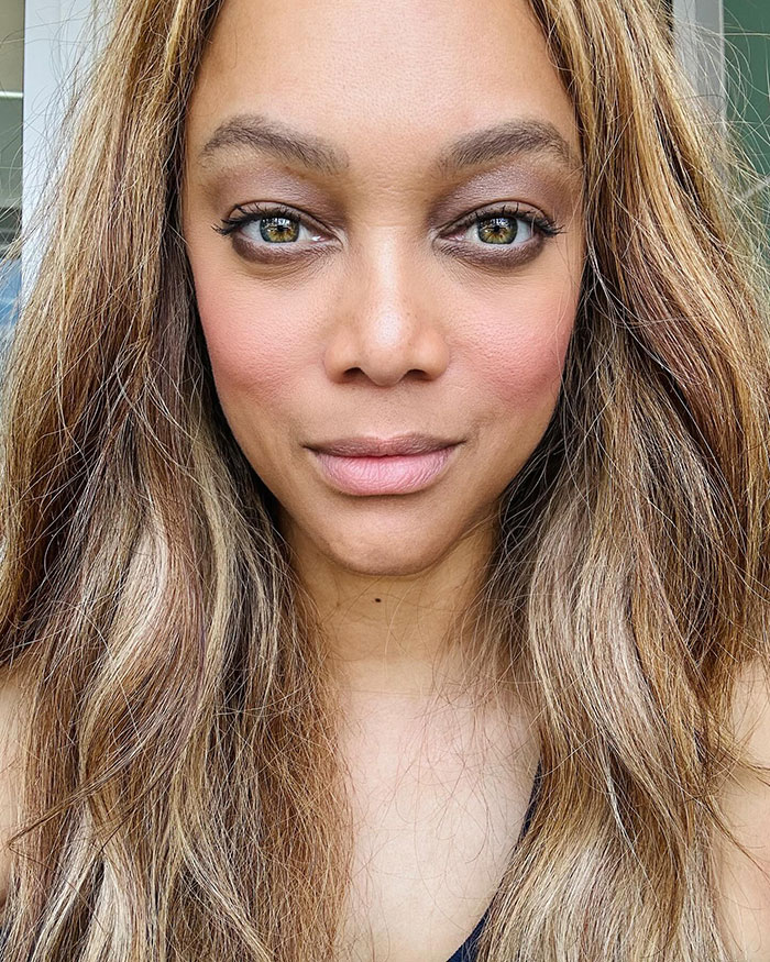 Makeup-free woman with wavy hair, showing a natural look. Makeup-free woman with wavy hair, showing a natural look.