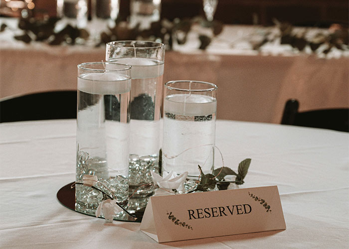 Reserved table with candles for Valentine's Day reservation setup. Reserved table with candles for Valentine's Day reservation setup.