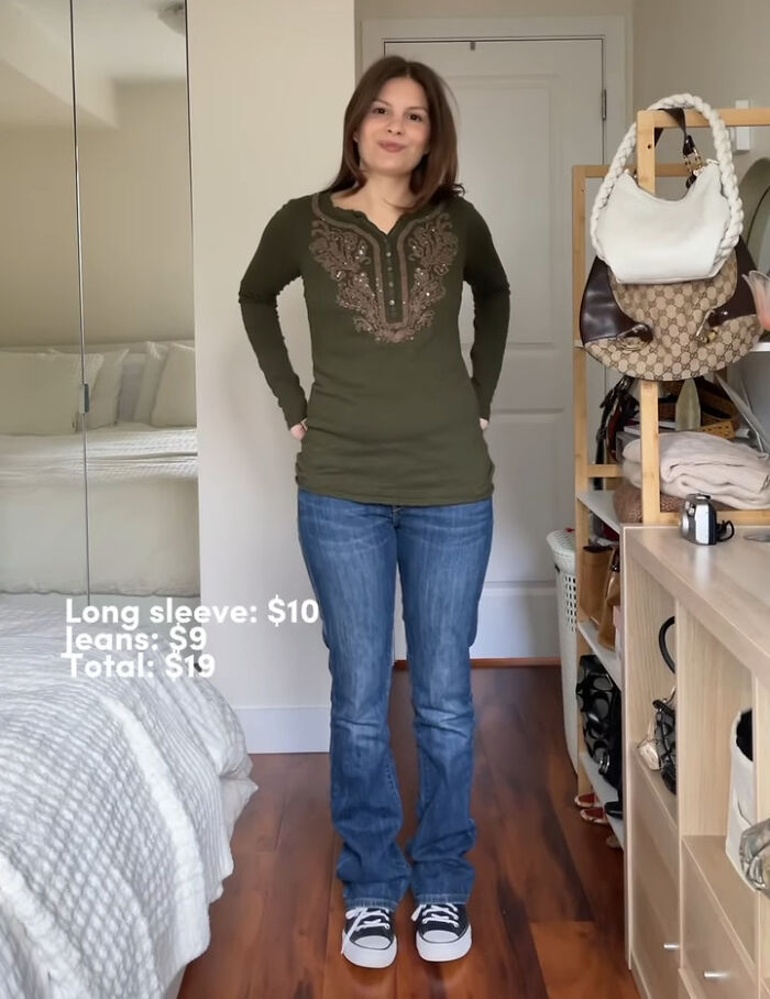 Person in green top and jeans, showcasing recent fashion trends people hate, with outfit prices listed beside.