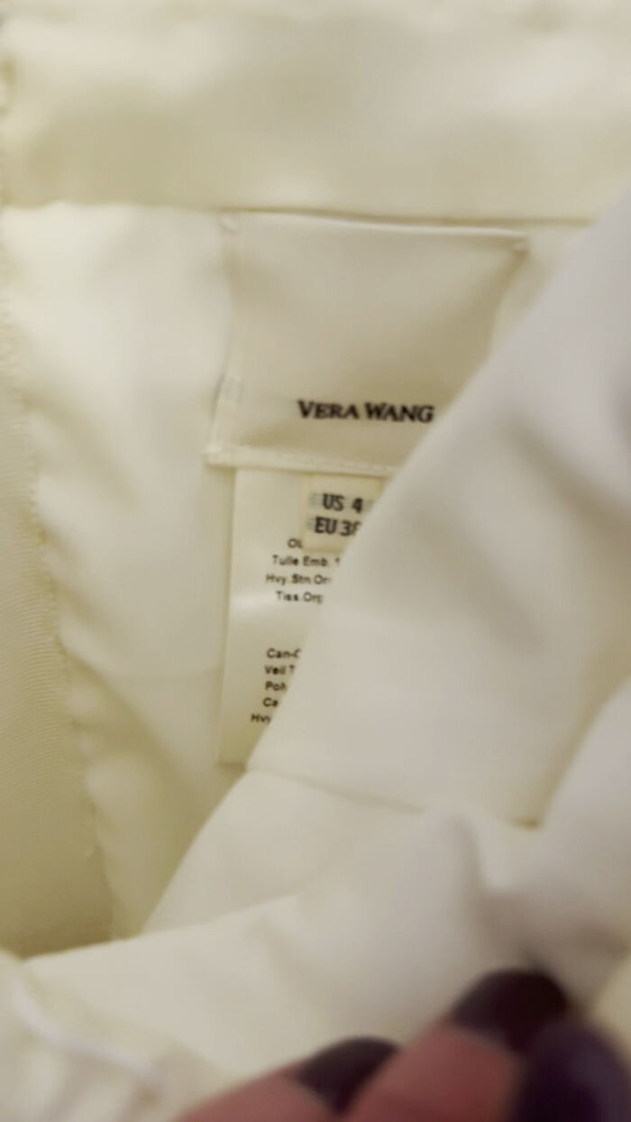 Close-up of a Vera Wang label inside a wedding dress, found by a thrift store shopper. Close-up of a Vera Wang label inside a wedding dress, found by a thrift store shopper.