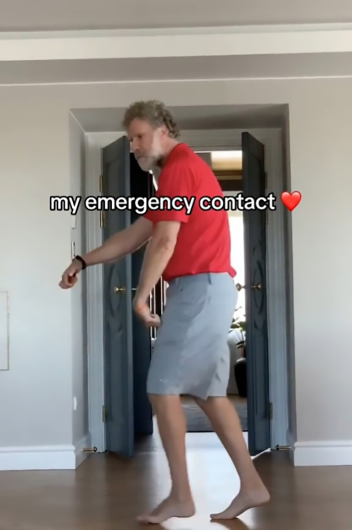 Will Ferrell in a red shirt and gray shorts dancing humorously in a room, captioned "my emergency contact" with a heart emoji. Will Ferrell in a red shirt and gray shorts dancing humorously in a room, captioned "my emergency contact" with a heart emoji.