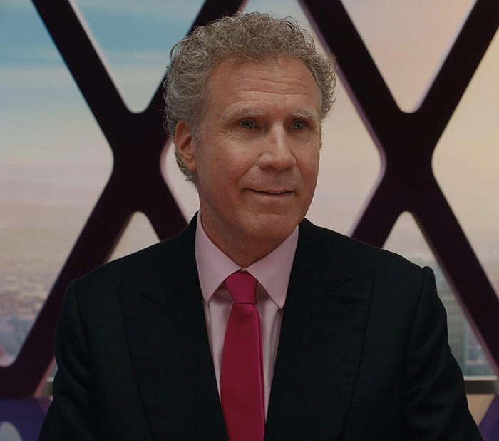 Will Ferrell in suit and pink tie smiling from the movie "Barbie. Will Ferrell in suit and pink tie smiling from the movie "Barbie.