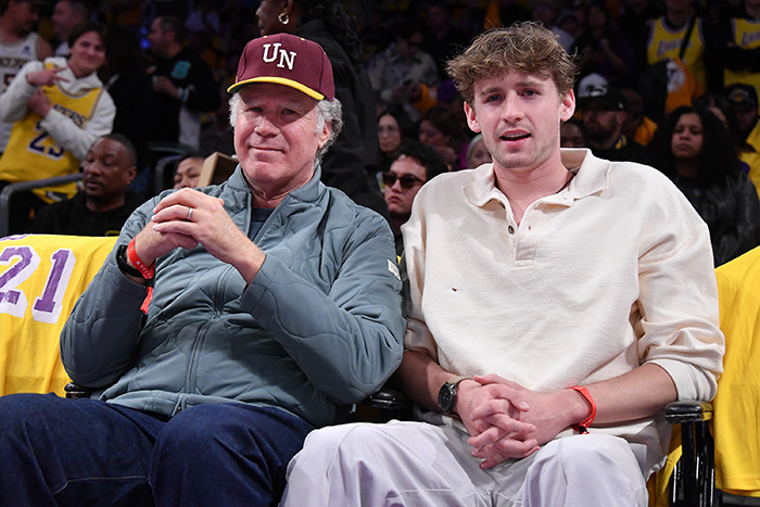 Magnus Ferrell and Will Ferrell enjoying a sports event. Magnus Ferrell and Will Ferrell enjoying a sports event.