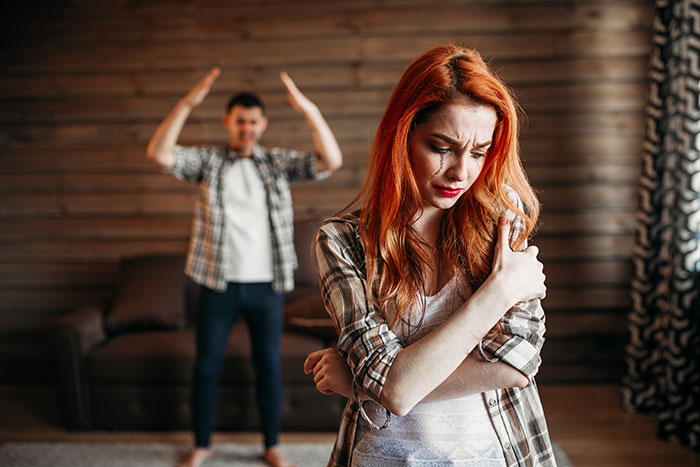 Couple arguing in a rustic room, illustrating relationship demands and reality check themes. Couple arguing in a rustic room, illustrating relationship demands and reality check themes.