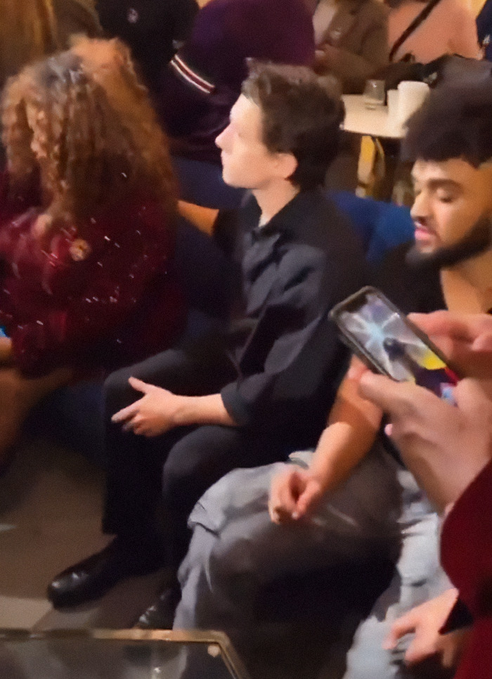 People at a lively family gathering, engaged and enjoying the atmosphere. People at a lively family gathering, engaged and enjoying the atmosphere.