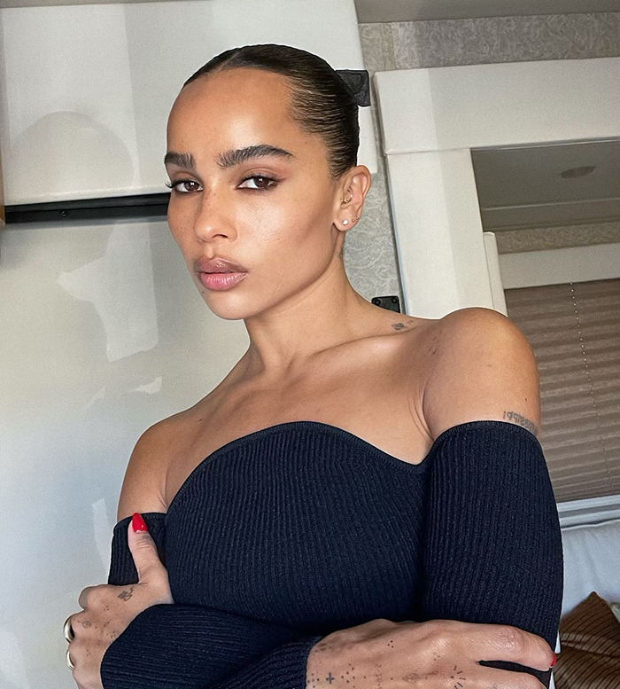 Woman in a black off-shoulder top with sleek hair, linked to Jason Momoa's publicity. Woman in a black off-shoulder top with sleek hair, linked to Jason Momoa's publicity.