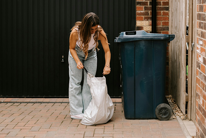 Woman retrieves items from trash can, alleged stealing incident unfolds. Woman retrieves items from trash can, alleged stealing incident unfolds.