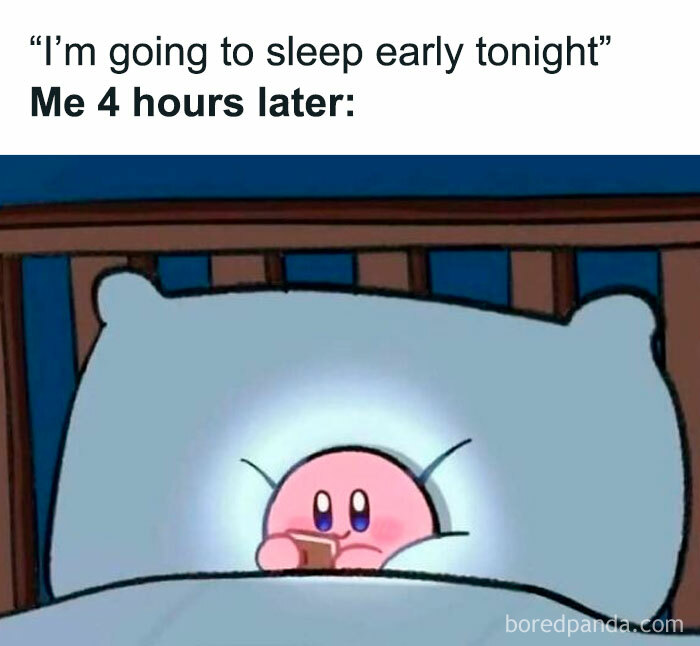 Cute pink character in bed staring at a phone.