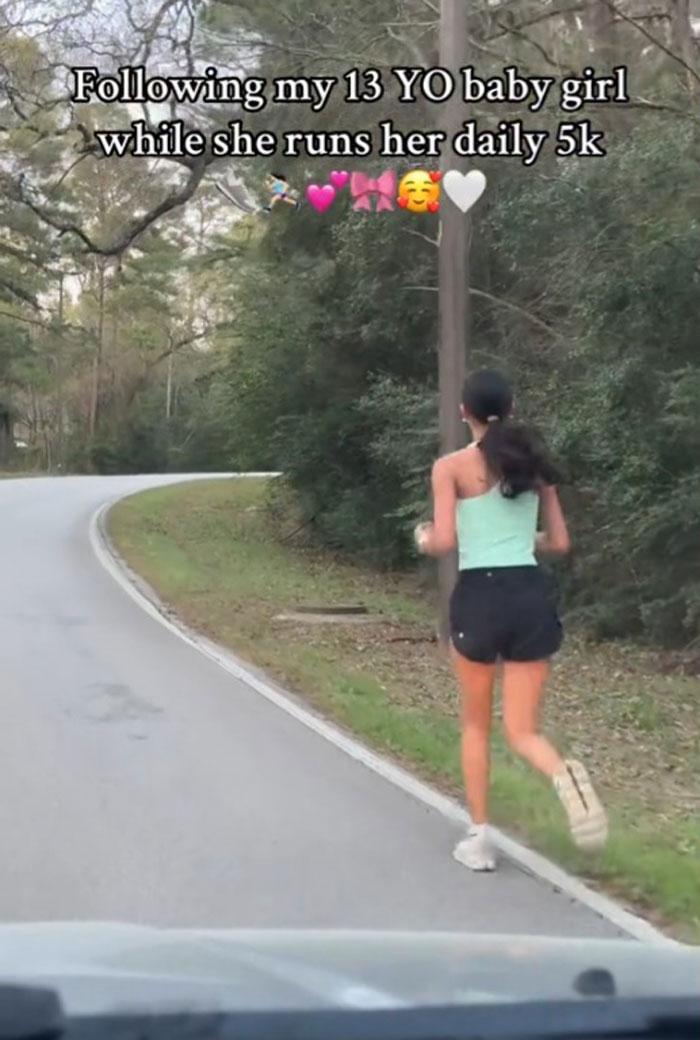 Mother follows daughter on her 5k run through a tree-lined road. Mother follows daughter on her 5k run through a tree-lined road.