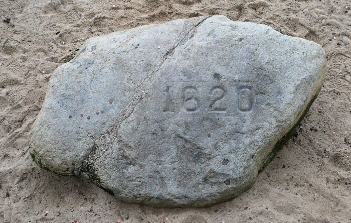 Large stone with "1620" carved on it, considered one of the overhyped touristy places by seasoned travelers.