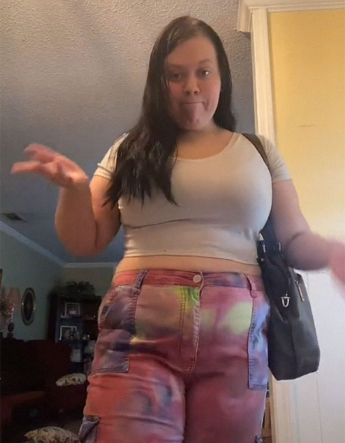 Plus-size woman in a casual outfit expressing frustration in a home setting, addressing uncomfortable spaces. Plus-size woman in a casual outfit expressing frustration in a home setting, addressing uncomfortable spaces.