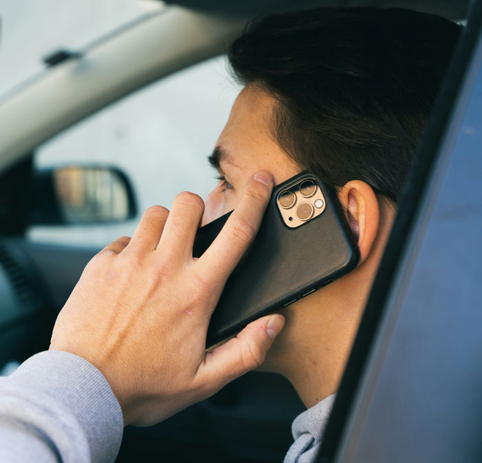 Man on a phone call in his car, reflecting on changes in his life related to church and marriage. Man on a phone call in his car, reflecting on changes in his life related to church and marriage.
