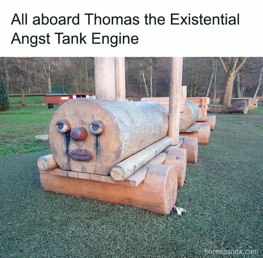 Wooden train sculpture with a comical face, captioned humorously, embodies hilarious meme aesthetics.