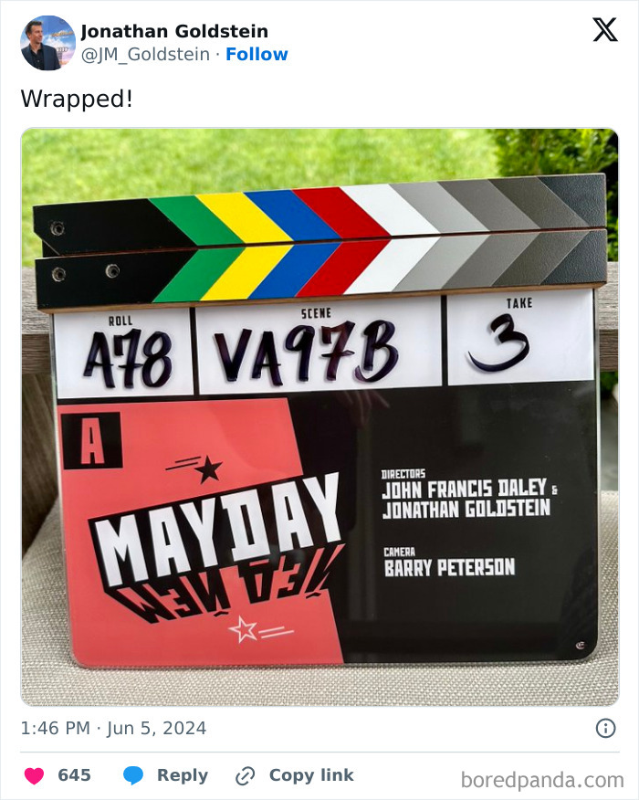 Film clapperboard with colorful stripes and text for the movie "Mayday," highlighting Ryan Reynolds' business ventures. Film clapperboard with colorful stripes and text for the movie "Mayday," highlighting Ryan Reynolds' business ventures.