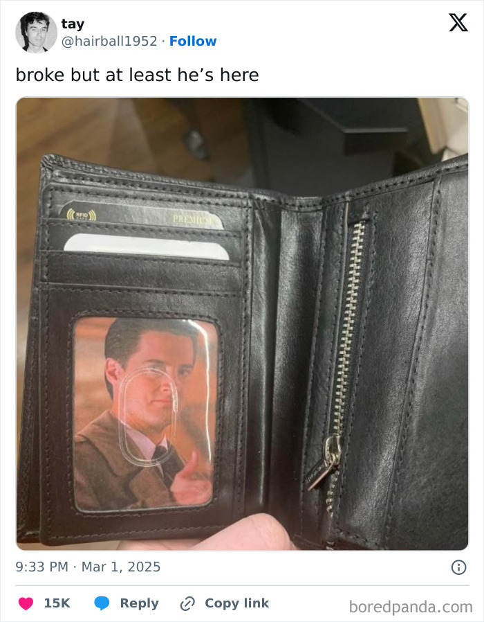 Black wallet with a picture of a man giving a thumbs-up, representing broke people jokes humor.