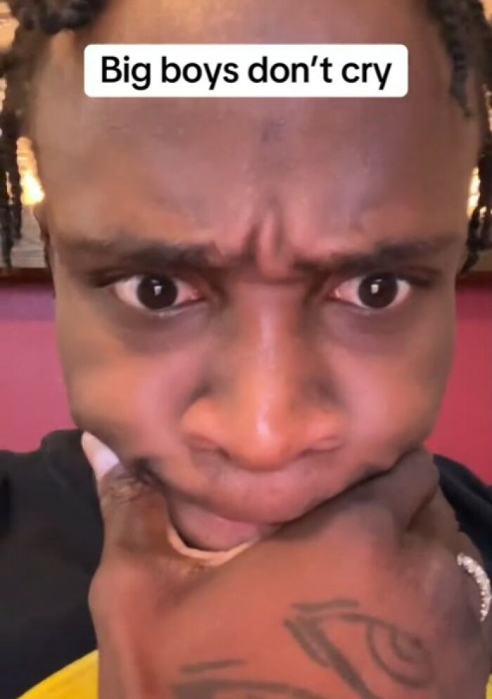 A man challenging the phrase "big boys don’t cry," expressing thoughtful reflection. A man challenging the phrase "big boys don’t cry," expressing thoughtful reflection.