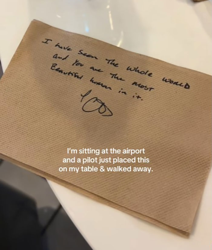 Napkin with a handwritten romantic note from pilot to passenger at airport. Napkin with a handwritten romantic note from pilot to passenger at airport.