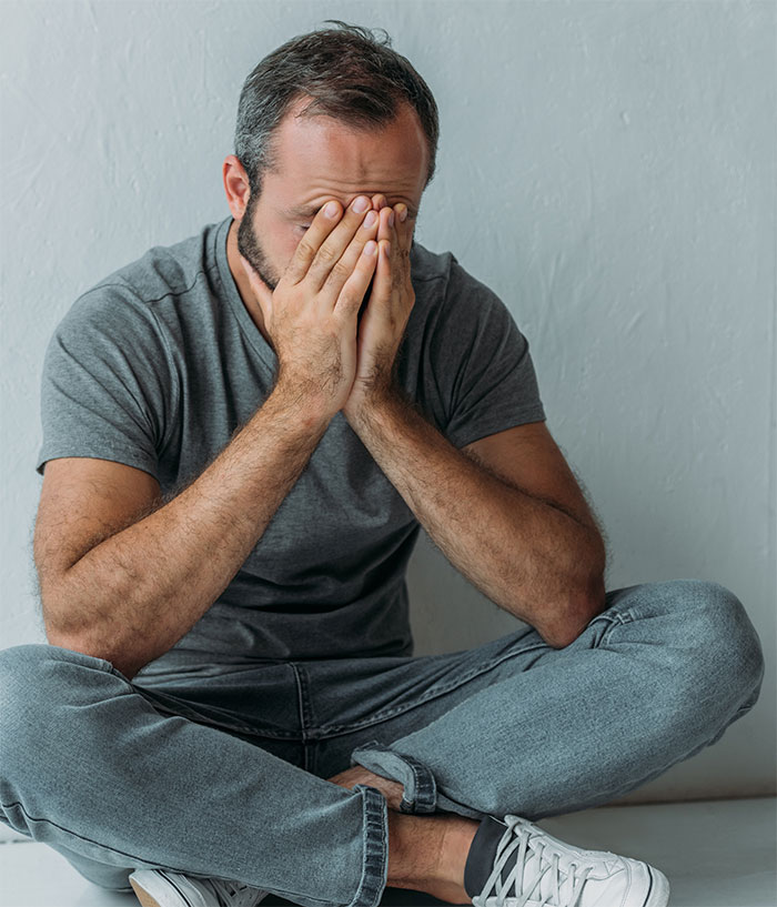 Man in distress sitting, planning surprise for daughter with tapes of her late mother, looking troubled. Man in distress sitting, planning surprise for daughter with tapes of her late mother, looking troubled.