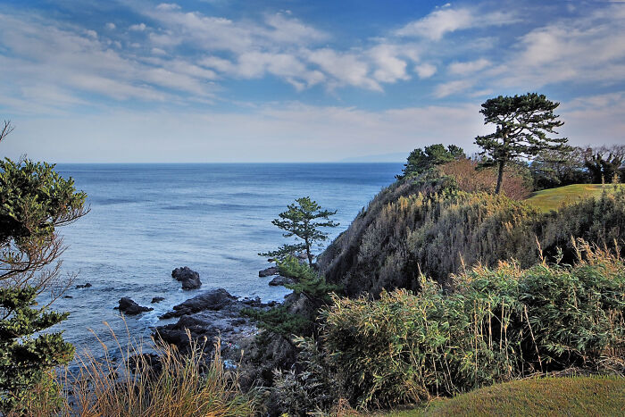 Breathtaking golf course with ocean views and lush greenery, showcasing scenic beauty for global golfers.