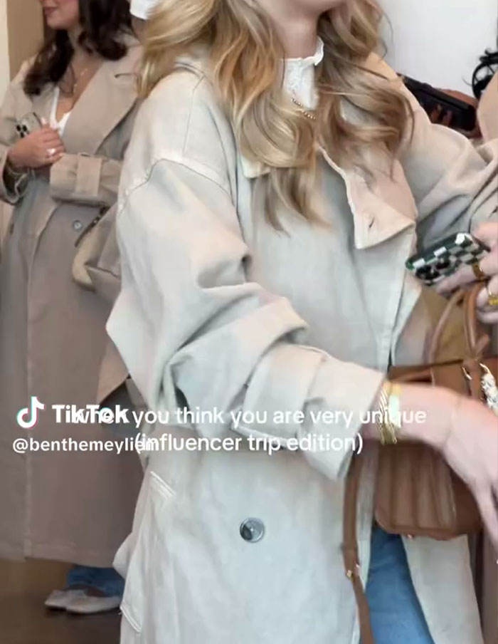 Influencers wearing similar beige coats, highlighting future fashion trends issue. Influencers wearing similar beige coats, highlighting future fashion trends issue.