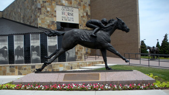 Statue of a horse and jockey at the Hall of Fame, considered overhyped by seasoned travelers.