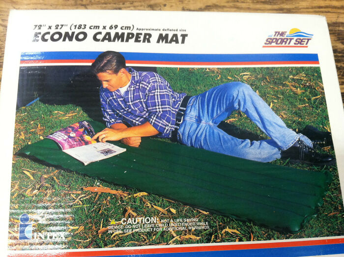 Camping mat design with person lounging on green mat, wearing jeans and plaid shirt, showcasing disastrous design ideas.