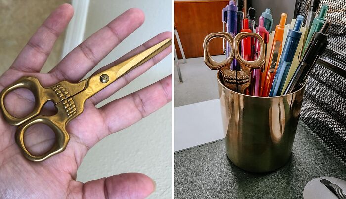 Gold scissors as part of office supplies, held in hand and placed in a pen holder, embodying office Olympics theme.