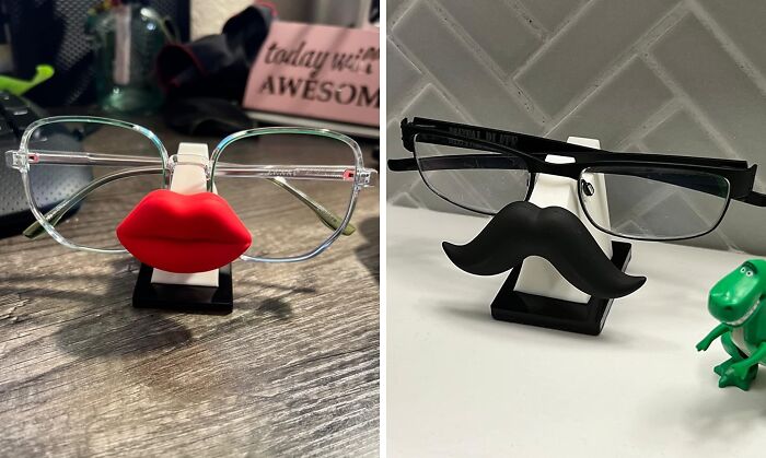 Quirky office glasses holders: one with red lips, the other with a mustache, adding fun to your workday desk setup.