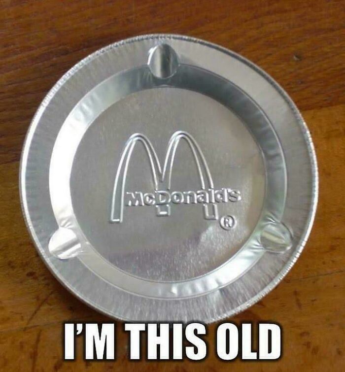 Vintage McDonald's aluminum pie tin on a wooden surface with nostalgic text about being old now.