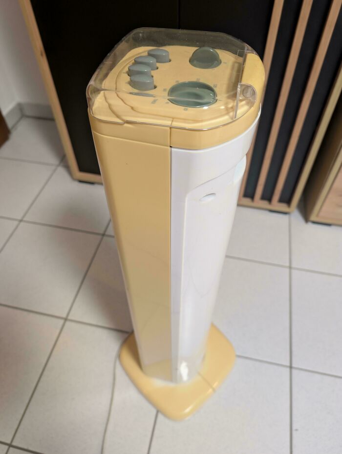 Tall beige and white appliance with buttons on top, illustrating things used over time indoors.