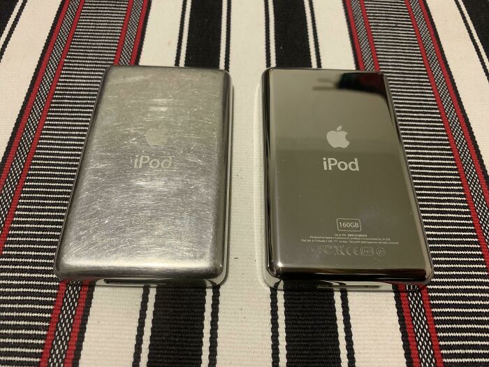 Two iPods on striped fabric; one is scratched, showing things used over time.