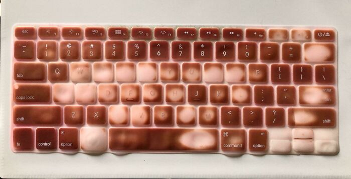 Worn keyboard cover showing key usage patterns over time, highlighting Things-Used-Over-Time concept.