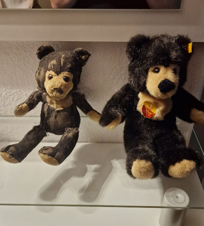 Two teddy bears on display, one worn and one new, illustrating the theme of time vs. things.