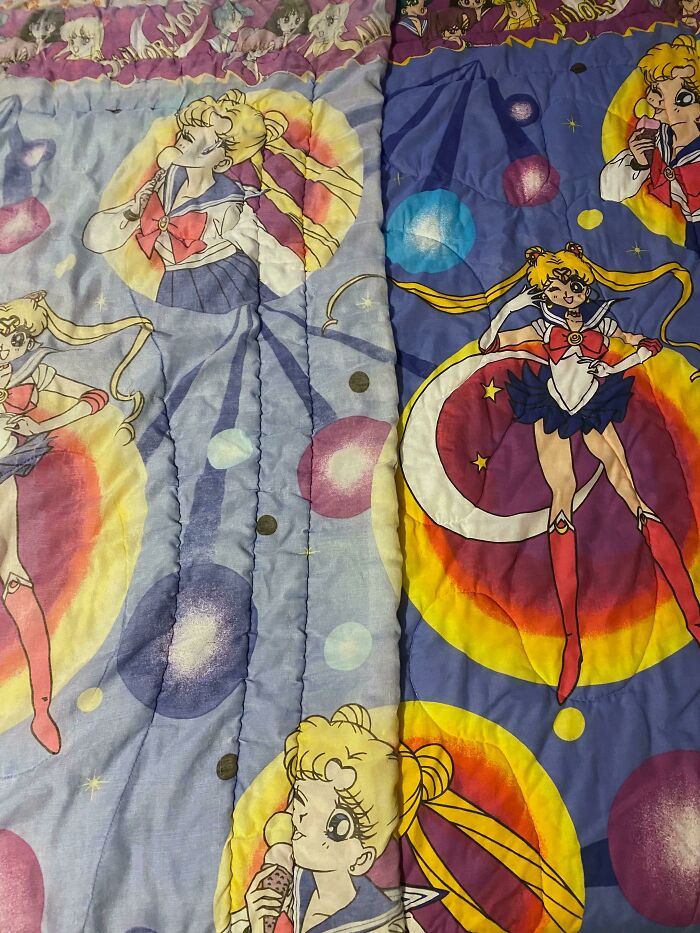 Illustrated characters on a colorful bedspread, showcasing a blend of time and things in playful patterns.