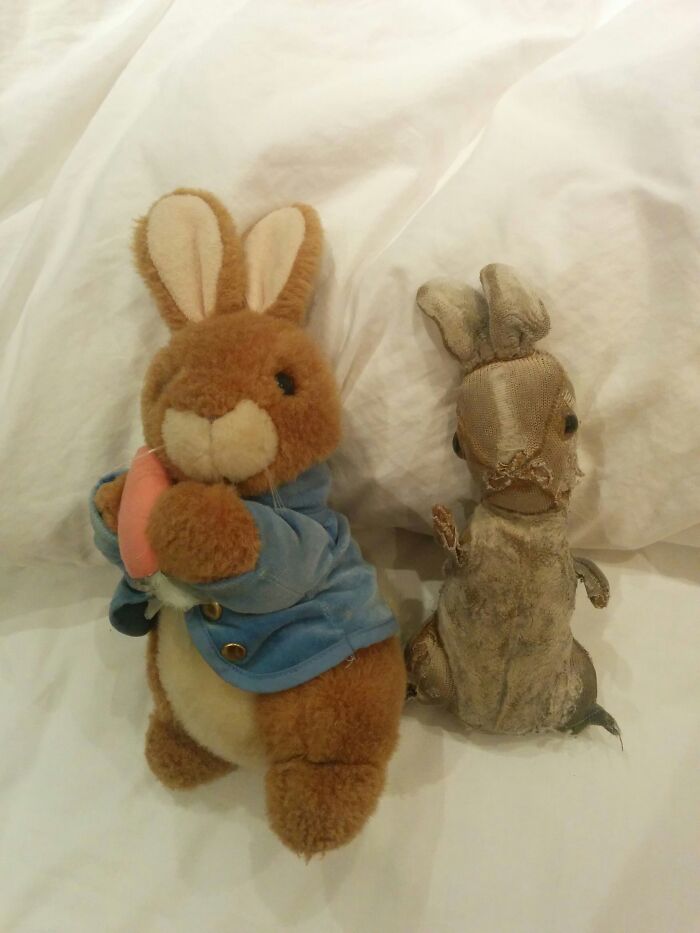 Two stuffed rabbits on a white background, illustrating Time vs. Things with one new and one worn.