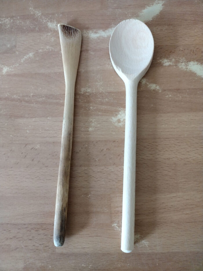 "Two wooden spoons on a table, one worn and darkened over time, contrasting newness and aging of things."