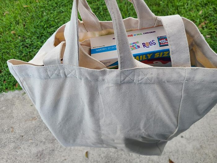 Canvas tote bag filled with groceries, ideal for a digital detox shopping trip.