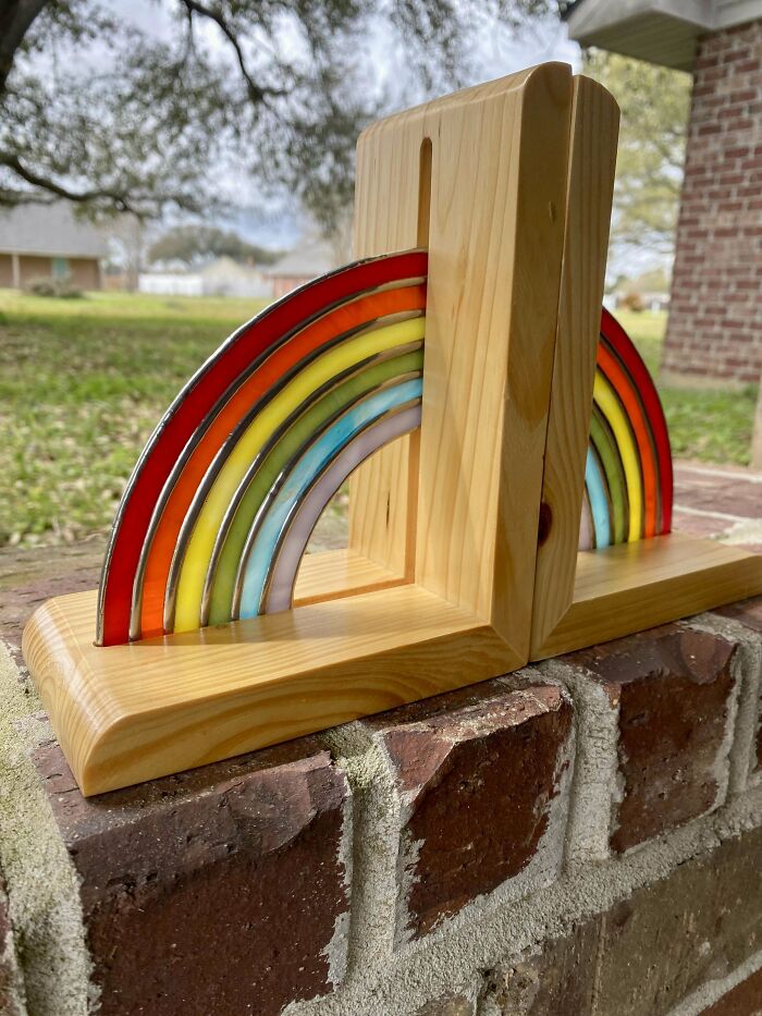 Handcrafted wooden bookend with a stained glass rainbow, showcasing a creative DIY project.