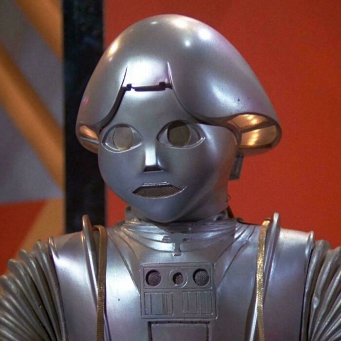 Retro metallic robot costume from nostalgic pics symbolizing people realizing they are old now in vintage style.