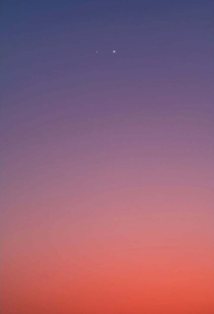Twilight sky with two bright celestial bodies captured, showcasing the beauty of astrophotography.
