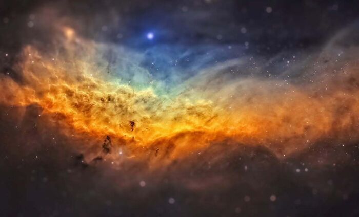 Colorful nebula captured in an astrophotography image of the night sky.