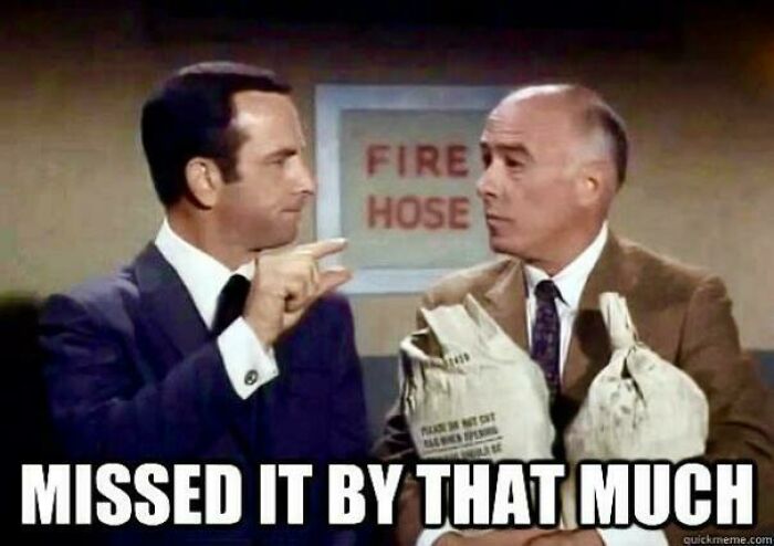 Two men in suits with a "Missed it by that much" caption in a nostalgic pic about realizing they’re old now.