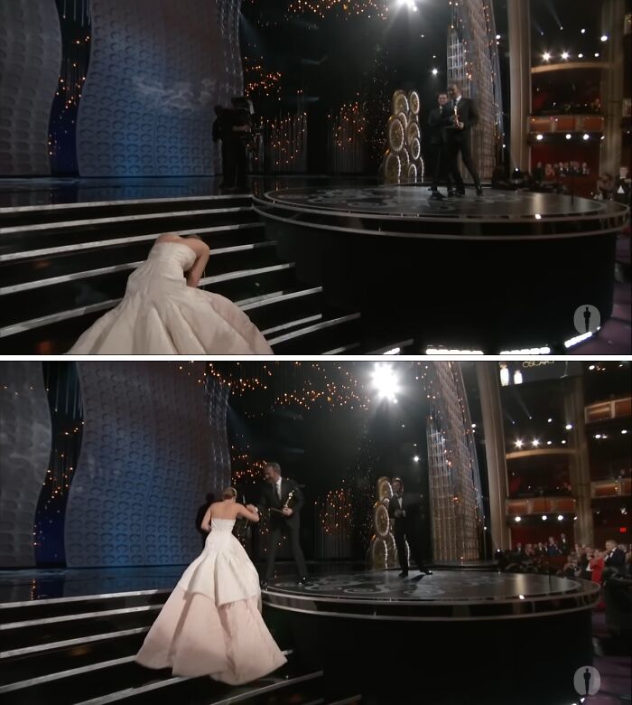 A woman in a white gown stumbles on stage stairs at an awards show, creating a scandalous moment.